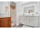 Bathroom featuring a double vanity and updated cabinets at 502 Brighton Pt, Atlanta, GA 30328
