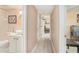 Hallway view into a bright bathroom with tiled shower and a modern vanity at 502 Brighton Pt, Atlanta, GA 30328