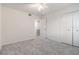 Bright bedroom featuring plush carpeting, ceiling fan and closet at 502 Brighton Pt, Atlanta, GA 30328