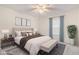 Inviting bedroom with a plush bed, bench, area rug, and natural light at 502 Brighton Pt, Atlanta, GA 30328