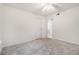 Cozy bedroom features plush carpeting, ceiling fan, and a closet at 502 Brighton Pt, Atlanta, GA 30328