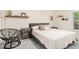 Cozy bedroom with chair and a comfortable queen sized bed with reading lights at 502 Brighton Pt, Atlanta, GA 30328