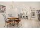 Elegant dining area open to kitchen, featuring stylish lighting and neutral tones at 502 Brighton Pt, Atlanta, GA 30328