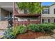 Inviting two-story condo with upper deck, stone accents, and lush landscaping at 502 Brighton Pt, Atlanta, GA 30328