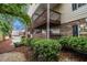 Apartment building featuring balconies, stone accents, and landscaped grounds at 502 Brighton Pt, Atlanta, GA 30328