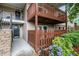 Charming condo exterior with stone accents, black door and decorative accents on the porch at 502 Brighton Pt, Atlanta, GA 30328