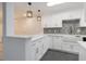 Updated kitchen featuring white cabinetry, granite countertops, and stainless steel appliances at 502 Brighton Pt, Atlanta, GA 30328