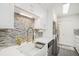 Well-lit kitchen features modern appliances, white cabinets and countertops and stainless steel refrigerator at 502 Brighton Pt, Atlanta, GA 30328