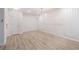 Open room with laminate flooring, decorative moldings, and natural light at 502 Brighton Pt, Atlanta, GA 30328