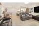 Open-concept living room with sleek light flooring and dining area, perfect for entertaining at 502 Brighton Pt, Atlanta, GA 30328