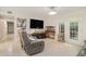 Bright living room with light floors, modern ceiling fan and lots of natural light at 502 Brighton Pt, Atlanta, GA 30328