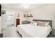 Spacious main bedroom featuring comfy queen sized bed with adjacent bathroom at 502 Brighton Pt, Atlanta, GA 30328