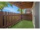 Private patio with artificial turf and wooden fence, ideal for relaxation at 502 Brighton Pt, Atlanta, GA 30328