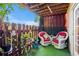 Covered patio featuring comfortable seating, a vibrant green lawn, and a charming garden fence at 502 Brighton Pt, Atlanta, GA 30328