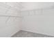Walk-in closet with shelving and carpeted floors at 502 Brighton Pt, Atlanta, GA 30328