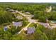 Aerial view of a stunning home nestled among lush greenery and mature trees in the community at 7511 Biltmore Ln, Douglasville, GA 30135