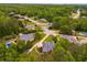 Aerial view of a home surrounded by lush trees, showcasing its prime location and neighborhood at 7511 Biltmore Ln, Douglasville, GA 30135