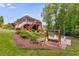 Beautiful backyard featuring a patio with seating, steps to the house and lush landscaping at 7511 Biltmore Ln, Douglasville, GA 30135