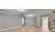 Large open basement area with wood-look floors, neutral paint, and base trim at 7511 Biltmore Ln, Douglasville, GA 30135