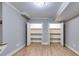 Spacious basement featuring two closets with shelving and new hardwood flooring at 7511 Biltmore Ln, Douglasville, GA 30135