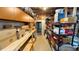 Basement storage space with shelving, boxes, and household items neatly arranged, offering ample storage capacity at 7511 Biltmore Ln, Douglasville, GA 30135