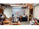 Functional basement workshop space with pegboard, workbenches, tools, and storage solutions for various projects at 7511 Biltmore Ln, Douglasville, GA 30135