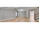 Spacious finished basement with hardwood flooring and stairway to upper level at 7511 Biltmore Ln, Douglasville, GA 30135