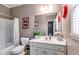 The bathroom provides a classic look with a shower and tub combination, a toilet, and a spacious vanity area at 7511 Biltmore Ln, Douglasville, GA 30135