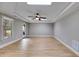 Large bedroom with hardwood flooring, skylight, and tray ceilings at 7511 Biltmore Ln, Douglasville, GA 30135