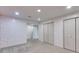 Carpeted bedroom with decorative wall paint and closets at 7511 Biltmore Ln, Douglasville, GA 30135