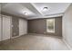 Carpeted bedroom with natural light and double closets at 7511 Biltmore Ln, Douglasville, GA 30135