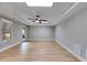 Bonus room with a ceiling fan, a skylight, and wood-look floors at 7511 Biltmore Ln, Douglasville, GA 30135