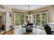 Cozy dining area bathed in natural light from large windows overlooking the landscape at 7511 Biltmore Ln, Douglasville, GA 30135