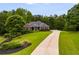 Beautiful brick home with a long driveway and lush landscaping at 7511 Biltmore Ln, Douglasville, GA 30135