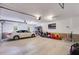 Spacious two car garage with ample storage, modern lighting, and clean epoxy floor at 7511 Biltmore Ln, Douglasville, GA 30135