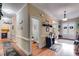 Wide hallway features hardwood flooring and elegant trim, leading to various rooms of the home at 7511 Biltmore Ln, Douglasville, GA 30135