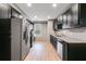 Updated kitchen with stainless steel appliances and granite countertops at 7511 Biltmore Ln, Douglasville, GA 30135