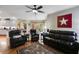 Open concept living room featuring hardwood floors and comfortable seating at 7511 Biltmore Ln, Douglasville, GA 30135