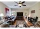 Open concept living room featuring hardwood floors, a ceiling fan, and comfortable seating at 7511 Biltmore Ln, Douglasville, GA 30135