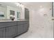 En-suite bathroom featuring dual sinks, granite countertops, and a tiled shower at 802 Chestnut Nw, Atlanta, GA 30314