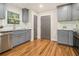 Updated kitchen featuring stainless steel appliances, granite countertops, and hardwood flooring at 802 Chestnut Nw, Atlanta, GA 30314