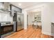 Modern kitchen with stainless steel appliances and hardwood floors at 802 Chestnut Nw, Atlanta, GA 30314