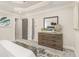 Well-appointed bedroom with tray ceiling and a glimpse into the en-suite bathroom at 802 Chestnut Nw, Atlanta, GA 30314