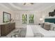 Spacious main bedroom with tray ceiling, ceiling fan, and natural light at 802 Chestnut Nw, Atlanta, GA 30314