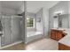 Bright bathroom featuring tile floor, large garden tub, glass enclosed shower at 973 Buckhorn Bnd, Locust Grove, GA 30248