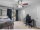 Bedroom with carpet, ceiling fan, four poster bed, and natural light from window at 973 Buckhorn Bnd, Locust Grove, GA 30248