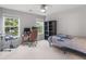 Bedroom with carpet, ceiling fan, and natural light from windows at 973 Buckhorn Bnd, Locust Grove, GA 30248