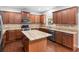 Spacious kitchen with granite countertops, stainless steel appliances and hardwood floors at 973 Buckhorn Bnd, Locust Grove, GA 30248