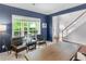 Comfortable living room with navy accent wall at 973 Buckhorn Bnd, Locust Grove, GA 30248