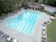 Aerial view of a community swimming pool with lap lanes and plenty of lounge chairs at 973 Buckhorn Bnd, Locust Grove, GA 30248